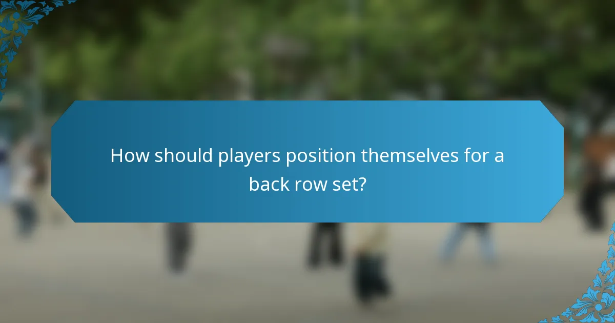 How should players position themselves for a back row set?